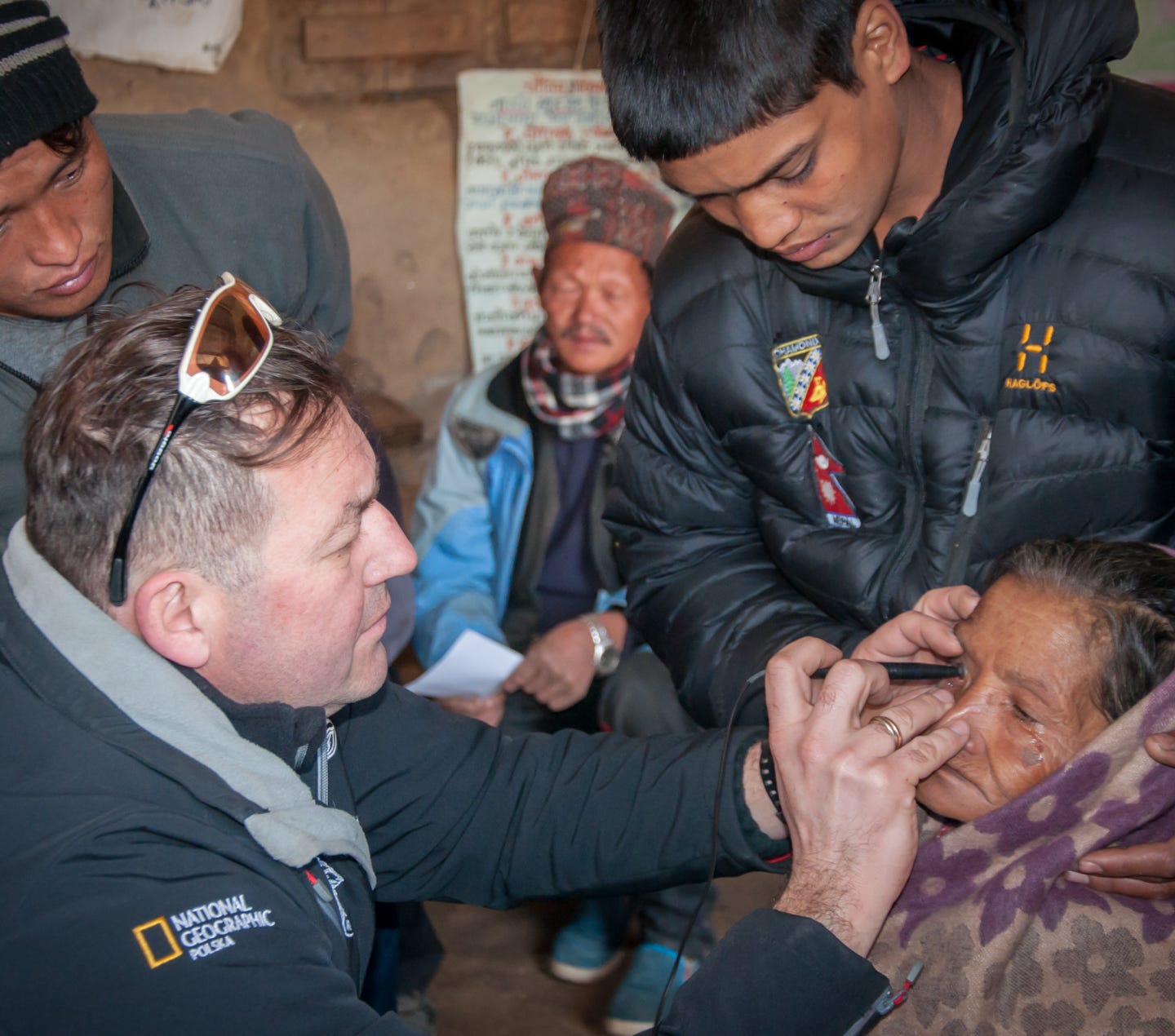 A patient undergoind biometry (inraocular lens power calculation) before cataract surgery at an eye camp